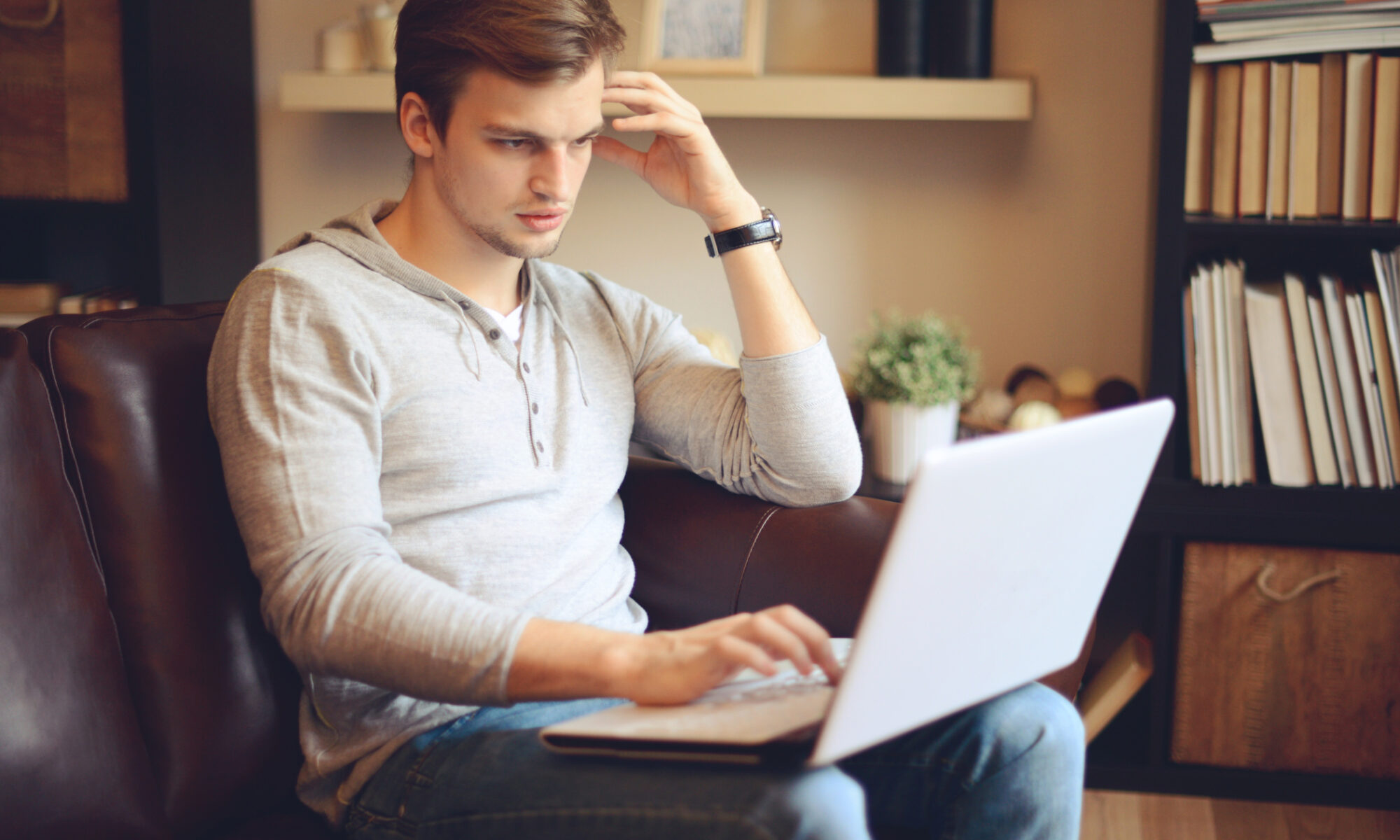 Student sitting and working on laptop